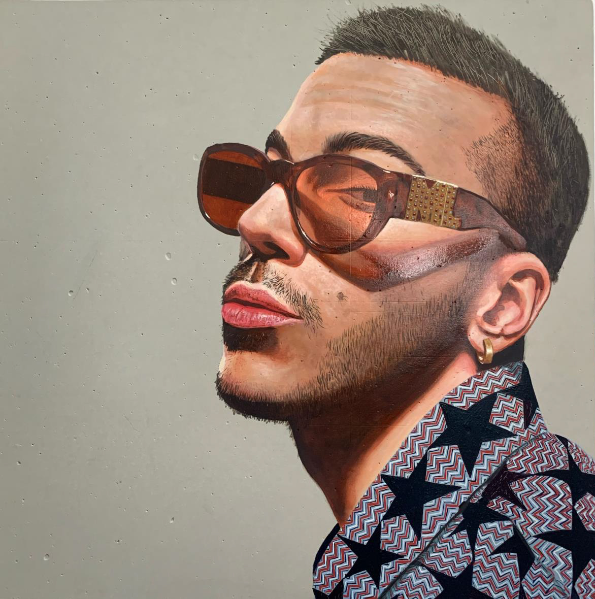 Young adult in t-shirt standing on front of glass wall