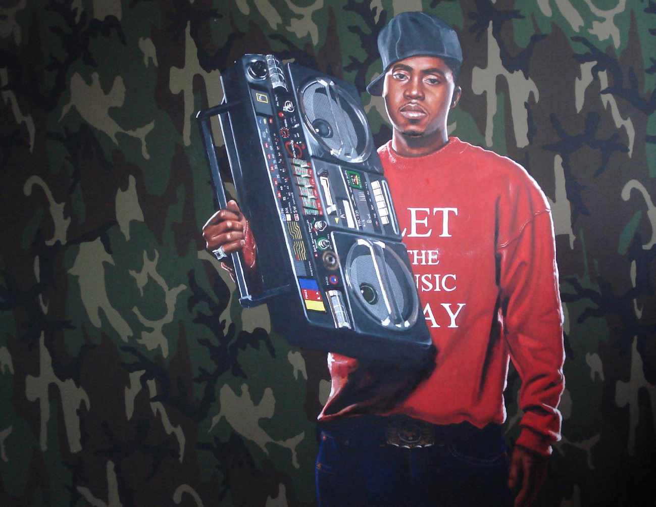 Young adult in t-shirt standing on front of glass wall